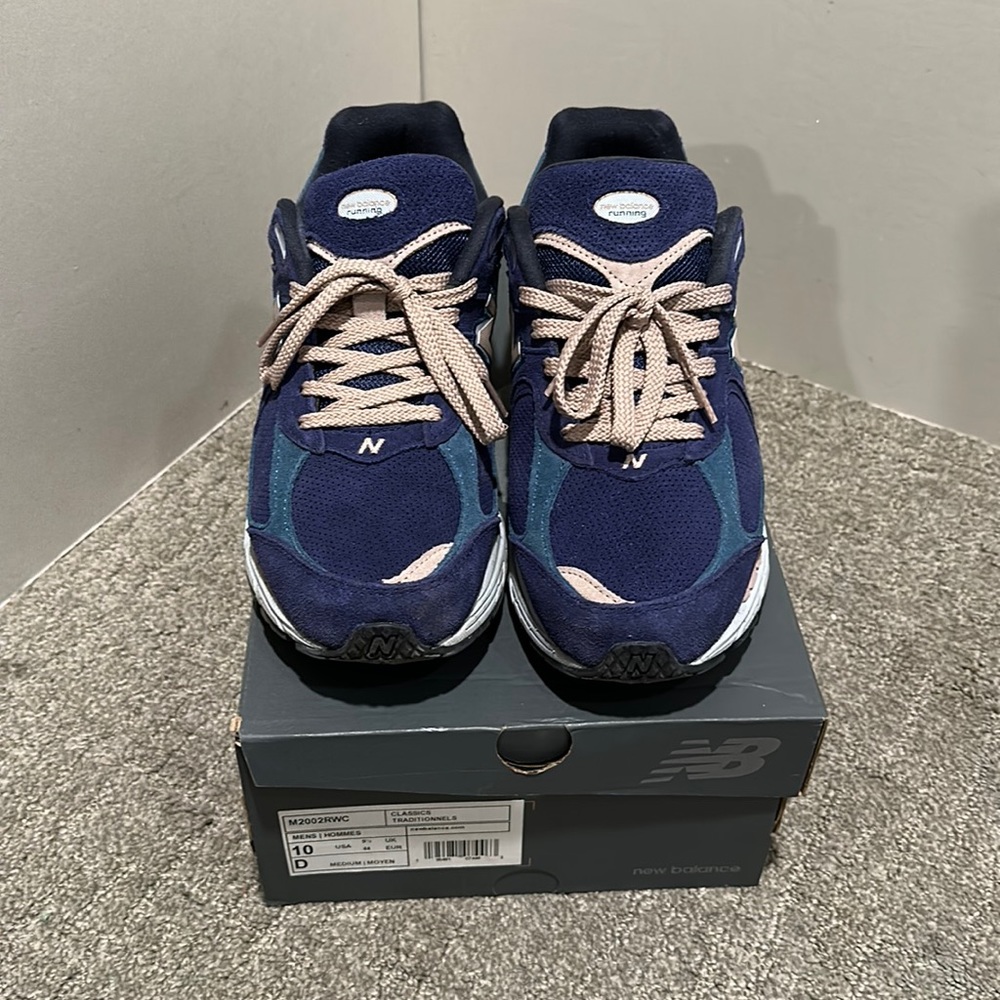 Gently used Men’s New Balance 2002R Indigo and Salmon size US 10